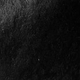 Close-up of black vegetable-tanned leather.